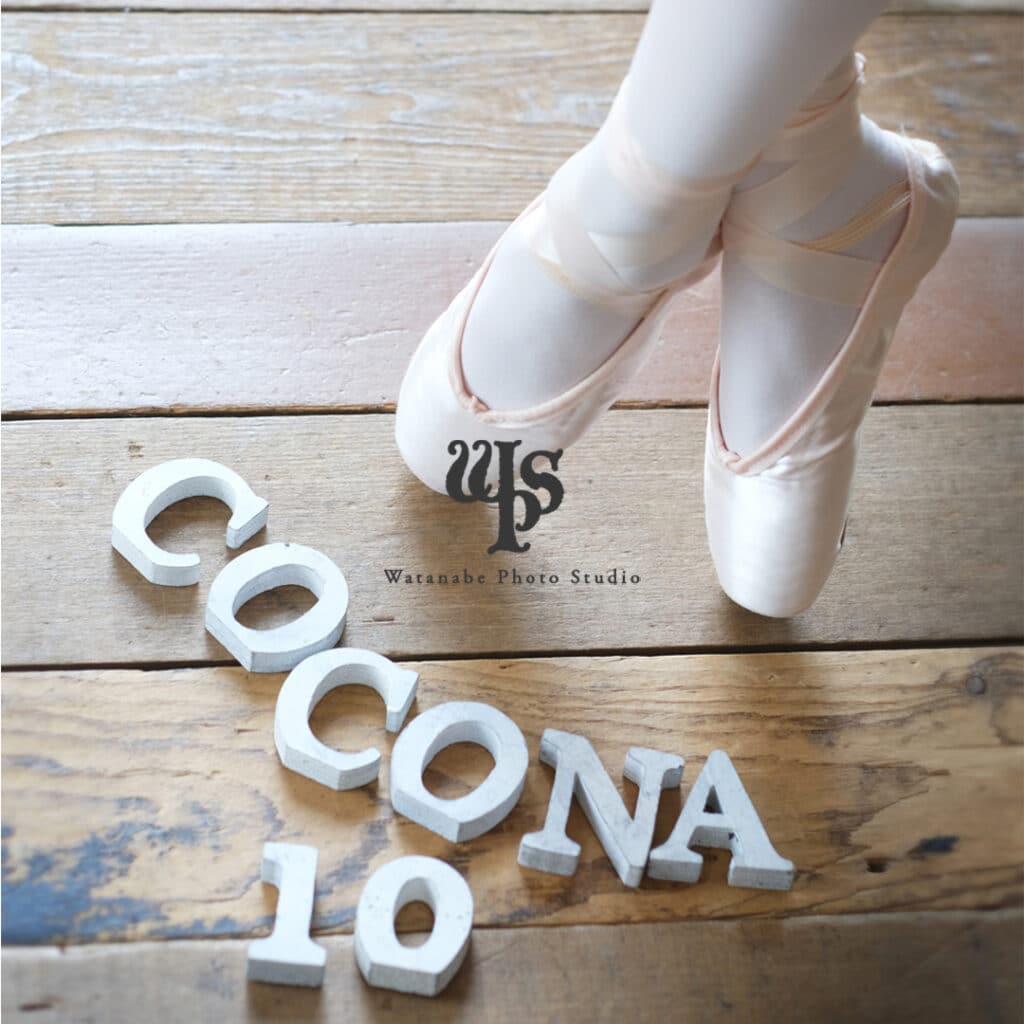 a person's feet in ballet shoes