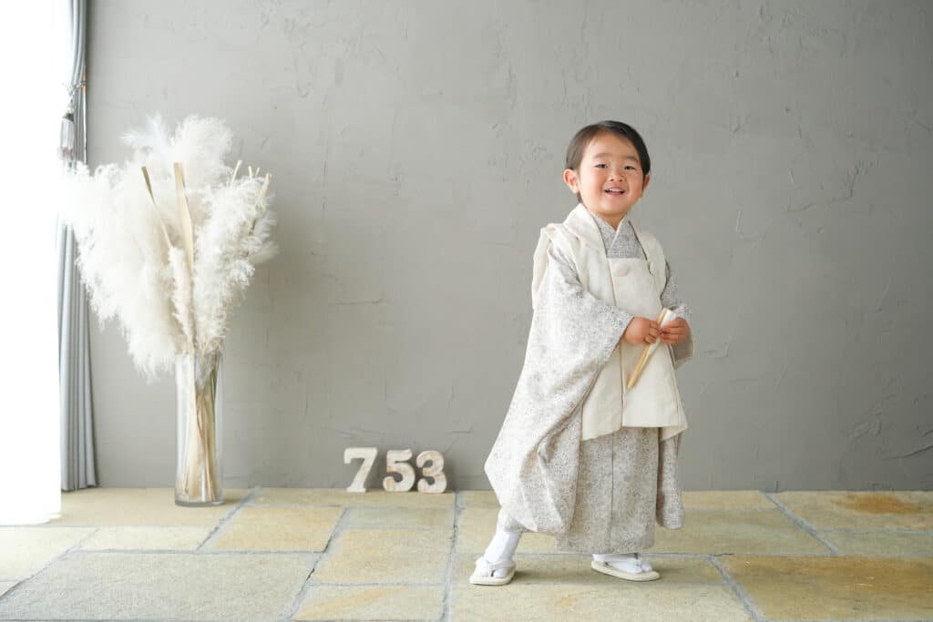 a child in a white robe