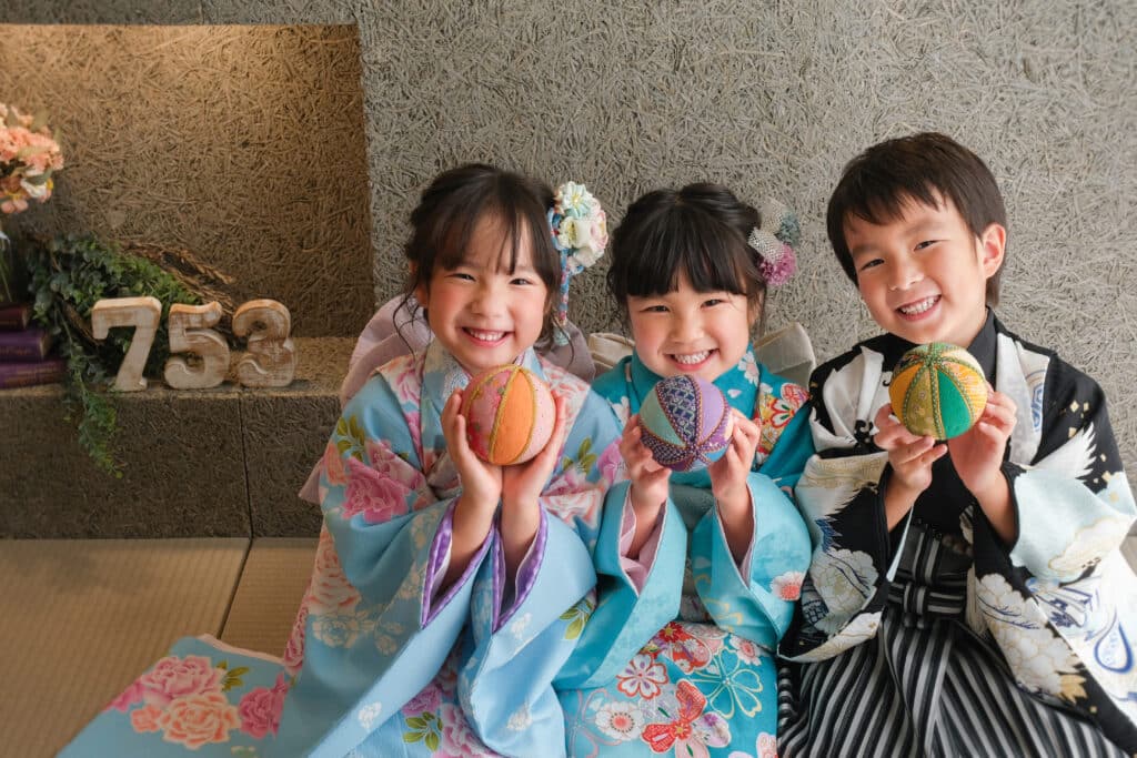 a group of kids holding colorful balls