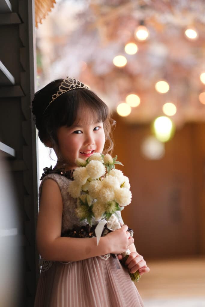 a girl holding a bouquet of flowers