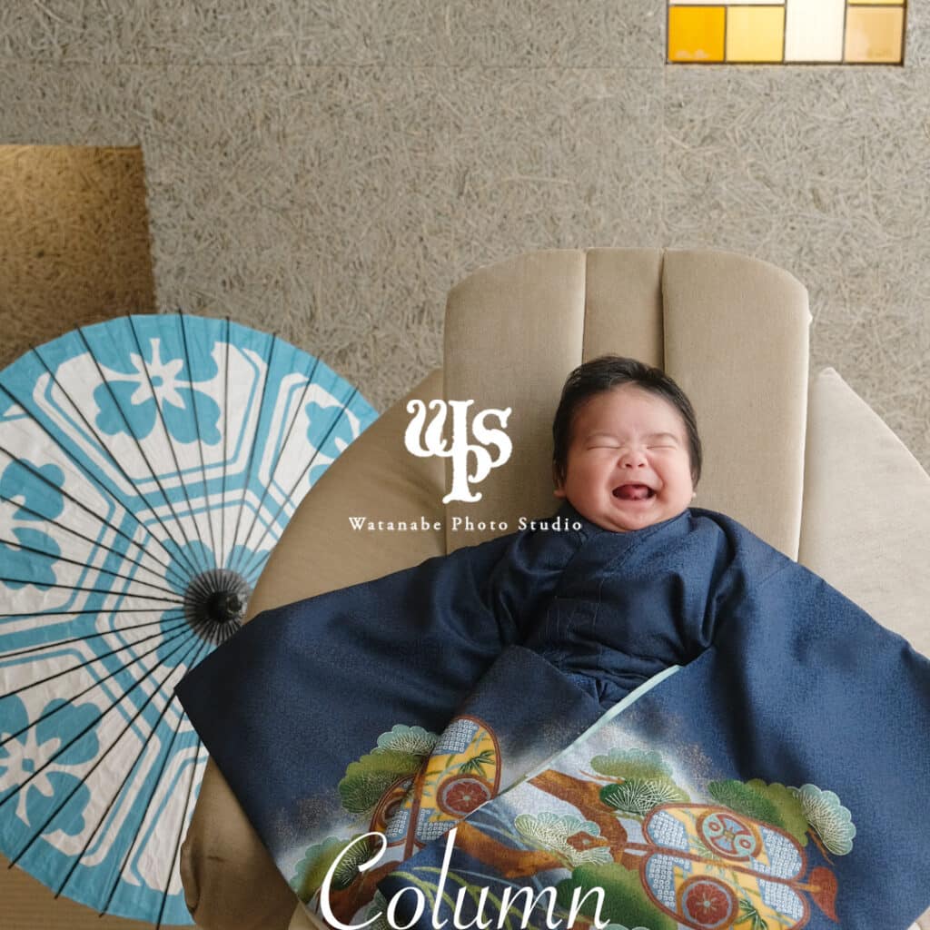 a baby lying on a chair
