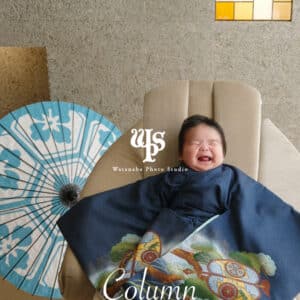 a baby lying on a chair