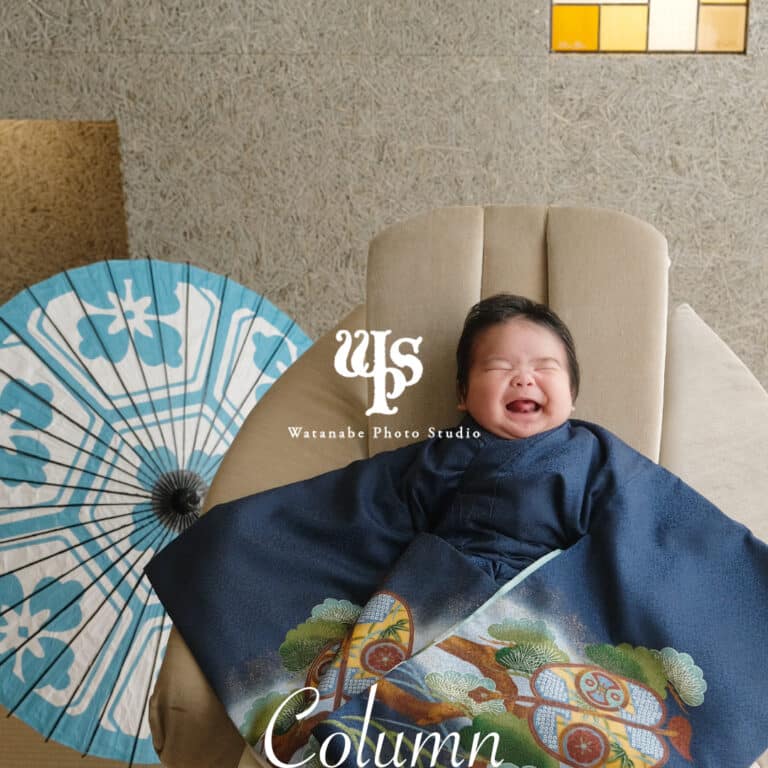 a baby lying on a chair